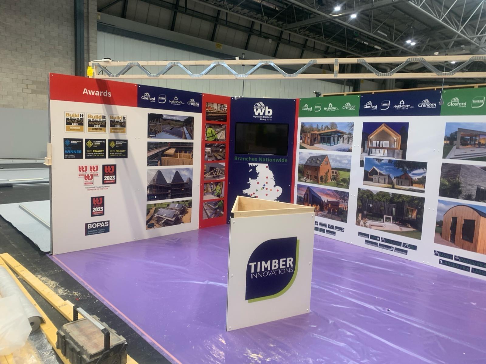 Timber Innovations branded stand being set up for an exhibition event