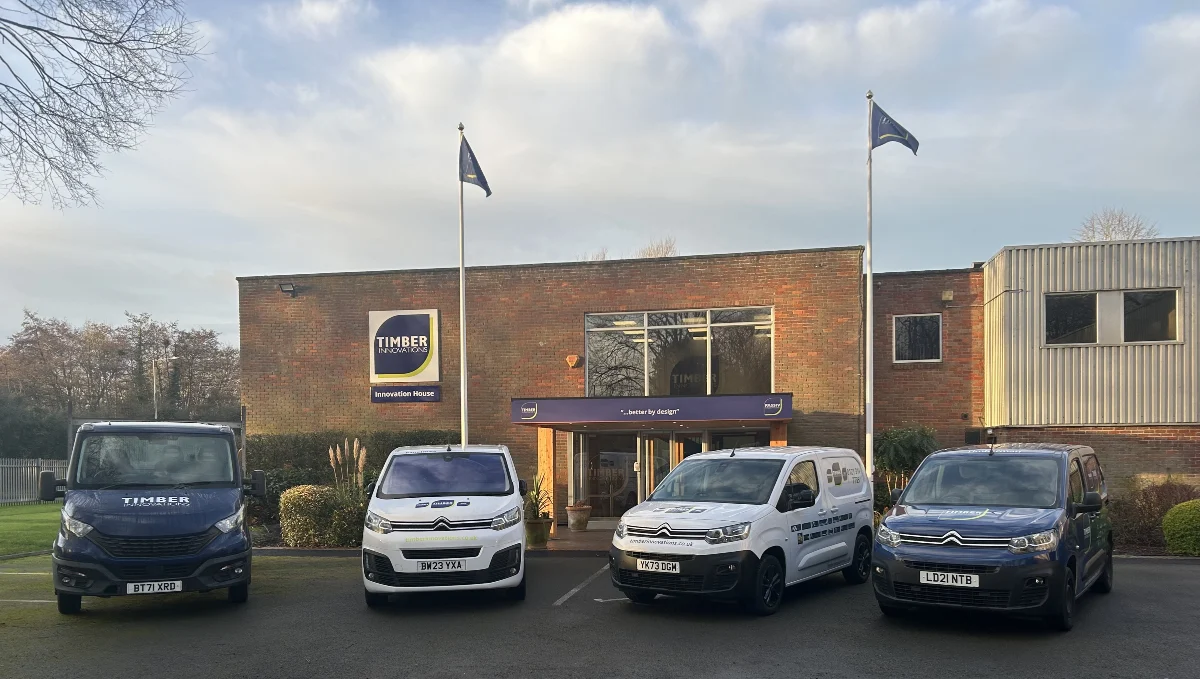 Vans in front of Timber Innovation building