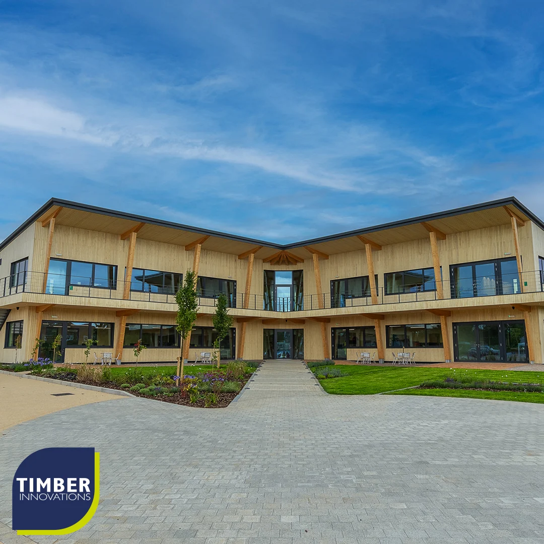 Wooden clad L shaped building from outside