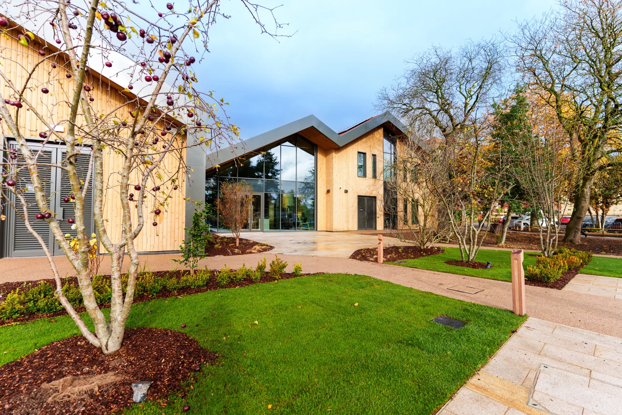 A modern, timber building with wide windows.
