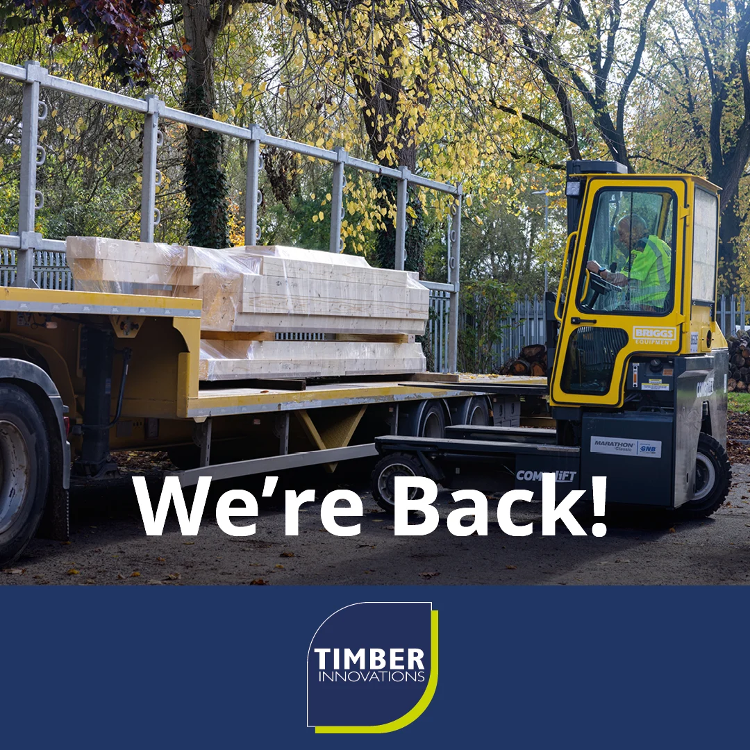 Timber being loaded onto a lorry.